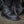 Load image into Gallery viewer, foot wearing black work boot with black string and black eyelets
