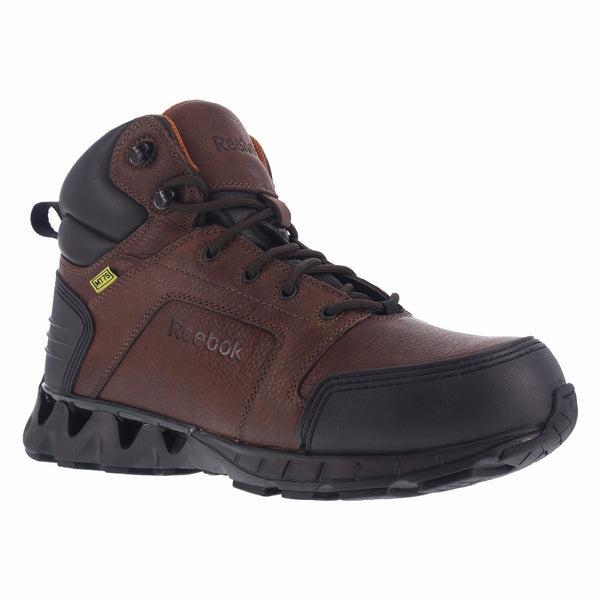 brown boot with black heel and toe guard. black laces and eyelets