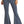 Load image into Gallery viewer, woman wearing medium blue bell bottom jeans, with button details on waistband and tan point toe boots
