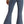 Load image into Gallery viewer, back view of woman wearing medium blue bell bottom jeans, with button details on waistband
