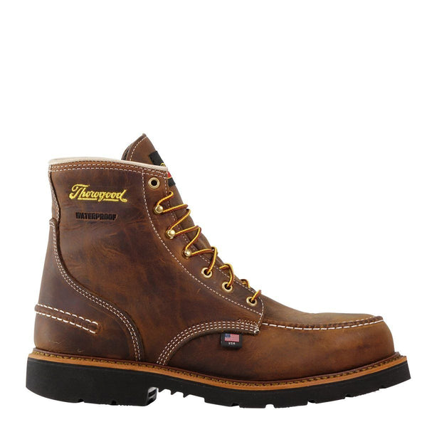 side of high top brown boot with yellow laces, black sole, and yellow logo on upper shaft