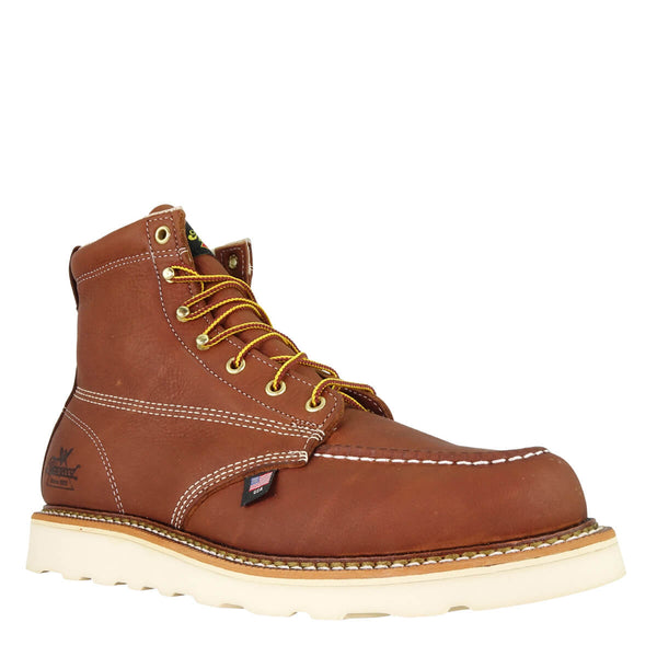angled view of brown/red mid-rise boot with yellow and brown laces and white sole