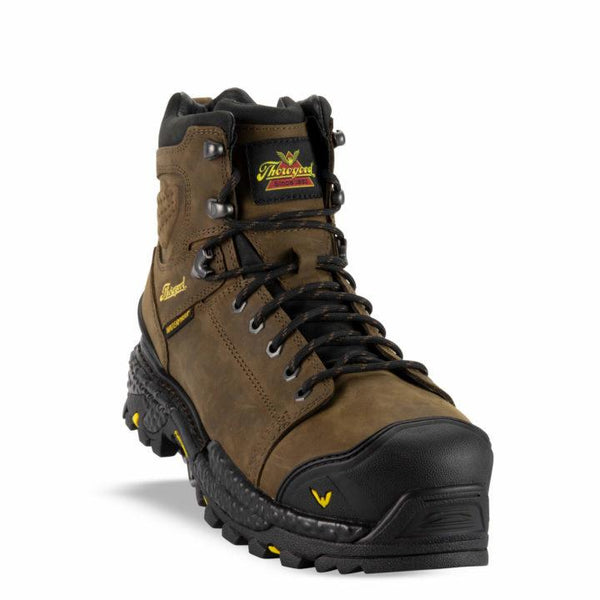 angle front of brown boots with black toe guard, black sole and laces, and yellow logo on side