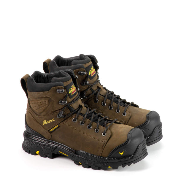 brown boots with black toe guard, black sole and laces, and yellow logo on side