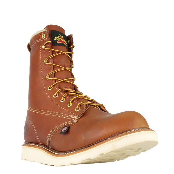 mens brown logger boot with white interior, sticthing, and sole. Black thorogood logo stamped on heel with gold/red laces. zoomed in front view