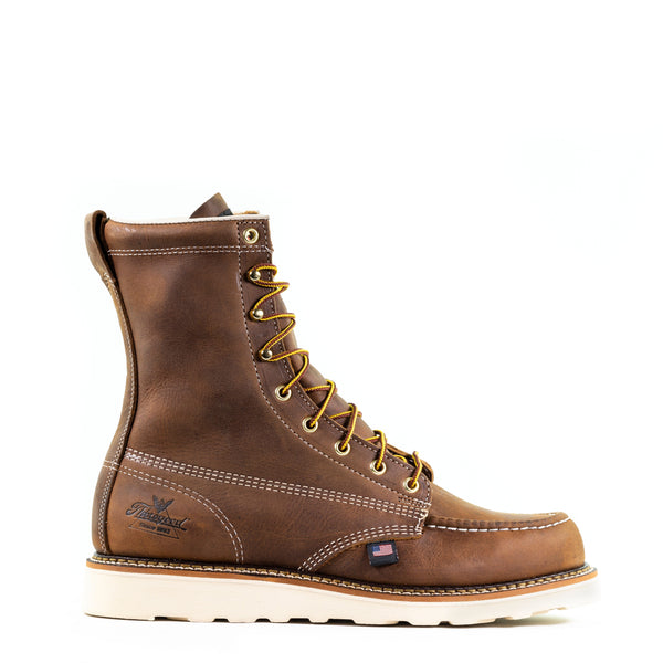 right side view of mens brown logger boot with white sole and stitching and black thorogood logo stamped on heel