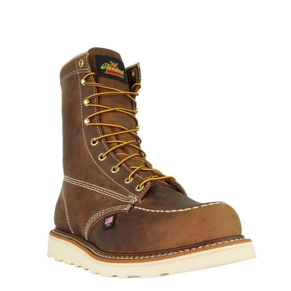 front of dark brown moccasin style boot with yellow and brown laces and white sole