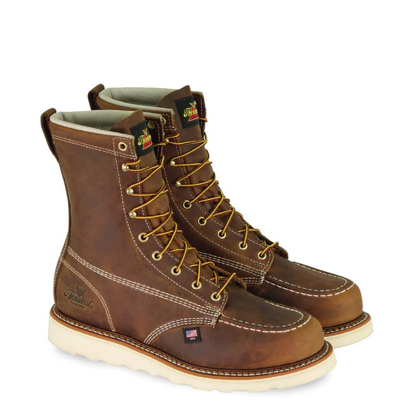 dark brown moccasin style boot with yellow and brown laces and white sole