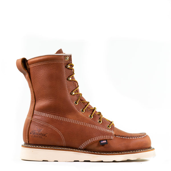 side view of mens light brown logger boot with white sole, stitching and interior. Yellow laces.