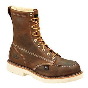 mens rugged brown logger boot with white interior, sticthing, and sole. Black thorogood logo stamped on heel with gold/red laces. zoomed out shot