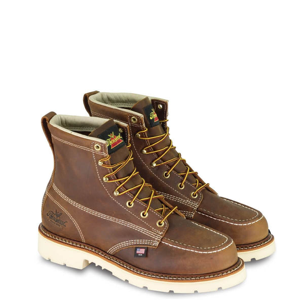 mens six inch brown logger boot with cream interior, sticthing, and sole. Thorogood logo stamped on heel with gold/red laces. Thorogood logo on tongue.
