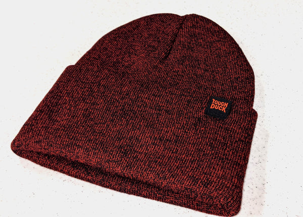 alternate view of red cuffed beanie with tough duck tag sewn on hem