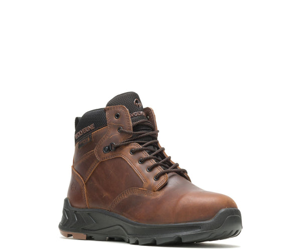front of brown lace up work boot with Wolverine logo on side and tongue