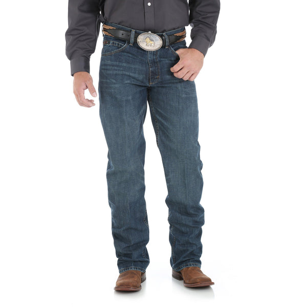 Man in Smoke Colored Solid Buttonup with big belt in dark blue jeans