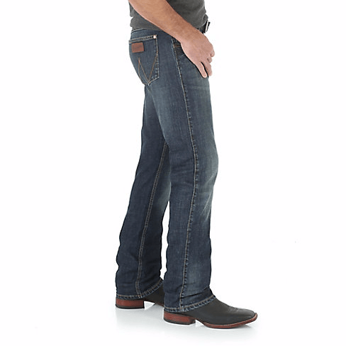 Man in Dark grey shirt & belt with blue jeans side angle