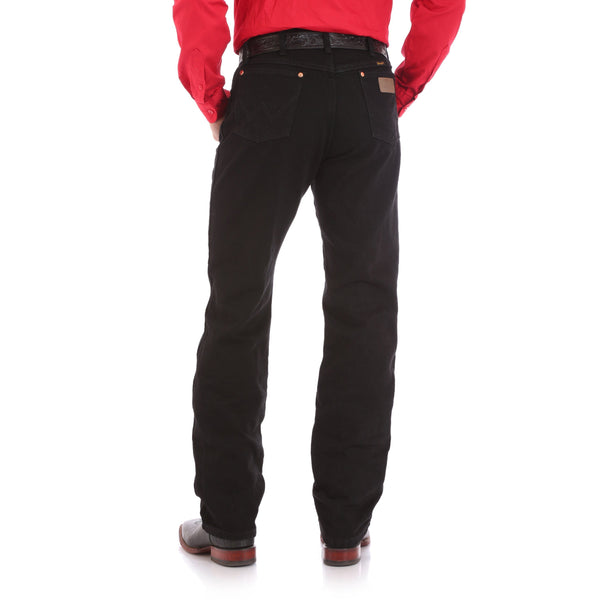 man in bright red solid shirt and black pants back view