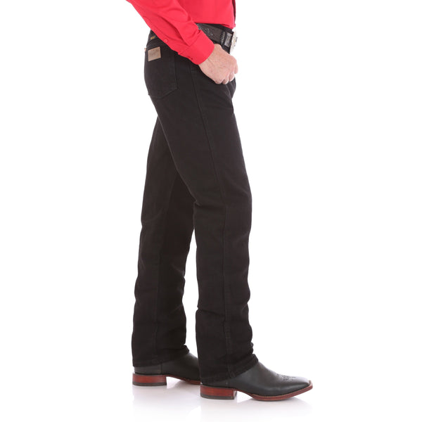 man in bright red solid shirt and black pants side view