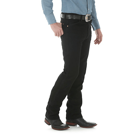 man in solid pale blue shirt and black pants side view