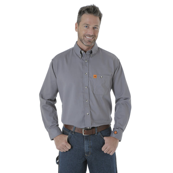  Man with hands in pocket wearing solid grey button up
