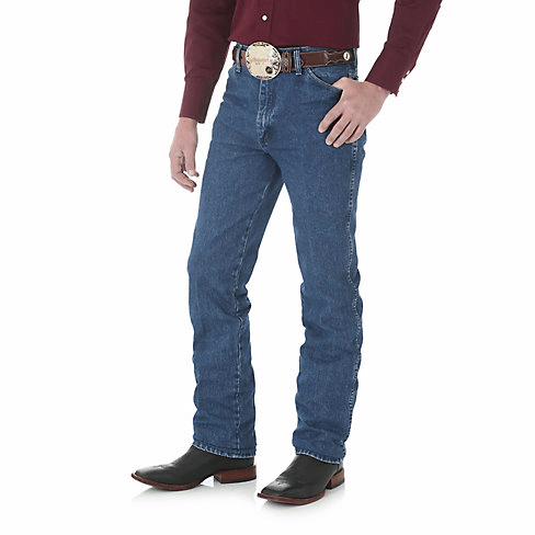 man in maroon shirt with big belt and blue jeans side angle