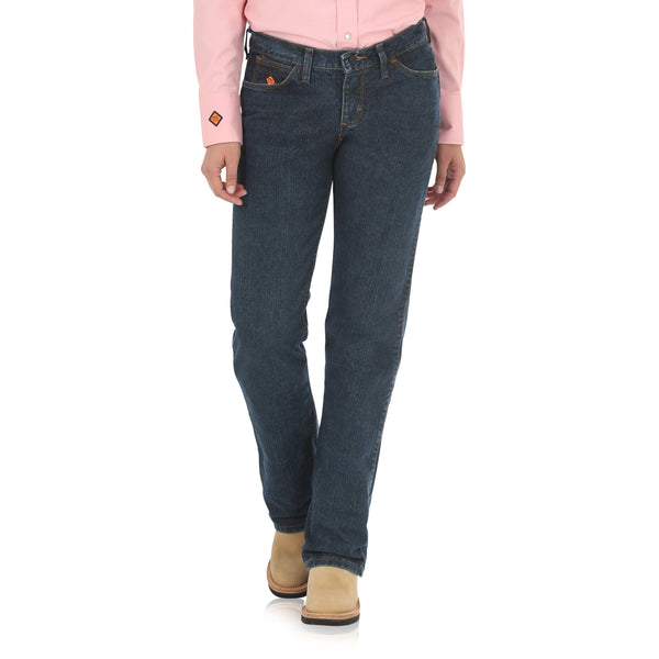 woman in pink button up wearing dark blue jeans