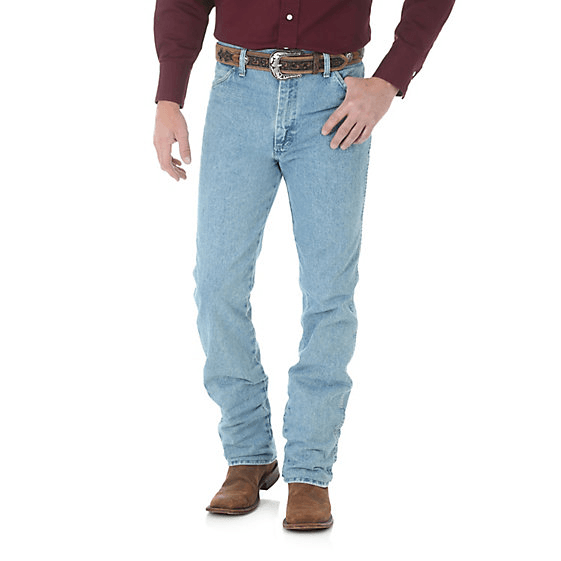 Man in light blue jeans wearing brown belt & boots